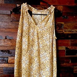 Tank top with tassel ties.